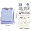 Calendario de escritorio de oficina transfronterizo del Año de la Oveja de 27 años, con un moderno esquema de color Morandi, un diseño minimalista y un cuaderno de cuadrícula grande para notas.