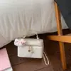 Bolsa Acolchoada com Corrente Estilo Coreano para Mulheres Nova Coleção Primavera 2026 Bolsa Transversal Simples de Mão Bolsa Quadrada Pequena de Ombro