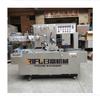 Máquina automática de empaquetado de cigarrillos Máquina de empaquetado de batería de labial y caja de medicamentos Máquina de empaquetado de caja de regalo cosmética Máquina de empaquetado con película Fabricante en Guangzhou