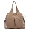 Bolso de tela nuevo de comercio exterior, bolso de mano versátil de color liso simple estilo japonés, bolso de hombro y cruzado casual de gran capacidad para el trabajo, moderno