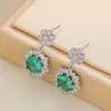Popular y moderno conjunto de joyería para mujer con una piedra principal de color dorado y verde azulado, que incluye un collar, pendientes y un anillo - Suministro al por mayor para ventas transfronterizas