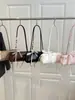 Bolso de mano de alta gama para llevar debajo del brazo para mujer, estilo coreano transfronterizo, moderno, bolso de hombro con mariposas, bolso simple para mujer, venta al por mayor