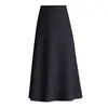 Falda versátil de color liso para mujer, nueva moda otoño e invierno 2026, de cintura alta, adelgazante, que cubre las caderas, larga, línea A, moderna