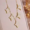Collar Rakol Estrella de Cuatro Puntas Incrustada de Cobre con Circonita Full Diamond Moda Cadena de Clavícula con Borla en Forma de Y Lujo Ligero Venta al por Mayor