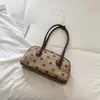 Bolsa de boliche estilosa com bolinhas da Shuai Mi, uma bolsa de mão de nicho para mulheres, bolsa de ombro casual, grande capacidade, adequada para o trabalho