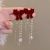 Otoño e Invierno flocado lazo borla de perlas clip para oreja pendientes sin perforar retro francés vino tinto lujo ligero pendientes súper de hada