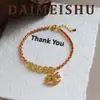 Pulsera de Cuerda Roja Tejida con Monedas, Crystal de Hielo Triturado y Carrusel Retro Exquisito, con un Toque de Lujo Ligero y Alta Gama, Accesorio Versátil y Elegante