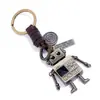 Personalidade simples retro tecido mãos e pés móveis robô cowhide chaveiro criativo menina saco pingente