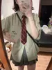 Traje de Camisa de Manga Corta a Rayas Verdes Estilo Perezoso para Mujer Verano Retro Universitario Top Holgado Falda Plisada Moderno