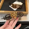 Tiara para el cabello de mujer con clip giratorio de gato con estampado de leopardo 2024 de alto nivel