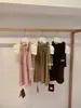 Wgwe9105 Ropa de Mujer Guangzhou Shisanxing Verano Nuevo Estilo Chaleco sin Mangas de Atar Cuello Halter Volante Top Versátil