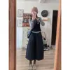 Um Conjunto de Duas Peças Muito Bonito para o Início do Outono Estilo Coreano, de Alta Qualidade, Camada Longa Preguiçosa Feminina + Saia Botão Redutora de Idade