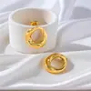 Brincos de ouro simples e modernos europeus e americanos para senhoras em aço inoxidável, brincos geométricos circulares vazados, joias no atacado