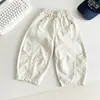 Vale do Vento 2026 Outono Novo Estilo Japonês Coreano Simples Calças Casuais de Algodão para Crianças Calças Versáteis para Meninos com Corte Assimétrico Novo Produto