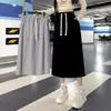 Saia Midi Elegante Estilo Coreano Nova Coleção Outono/Inverno 2026, Cintura Alta, Efeito Emagrecedor, Fenda nas Costas e Cintura Elástica, Estilo Casual Fino Versátil