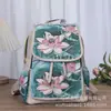 Mochila casual de doble uso tejida y bordada con jacquard de hilo de oro de estilo étnico, perfecta para viajar en Yunnan