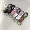 Llavero de cuerda tejida a mano de cuero para coche personalidad creativo colgante de llave patrón de texto imprimible venta al por mayor de fábrica