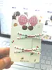 Pinza para el pelo con forma de cruz y lazo rojo de alto valor, estilo japonés dulce, simple, femenino, para flequillo, pinza de pico de pato, pasador, accesorios para el pelo