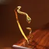 Pulseira Aberta Dourada Amarela com Olhos Verdes em Formato de Cobra Banhada a Prata Feminina Branca Exótica Popular Fábrica Joker Venda Direta