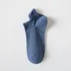 Calcetines blancos y negros para hombres y mujeres, calcetines de media pantorrilla para primavera y otoño, calcetines de algodón transpirables de color liso, calcetines deportivos para parejas, calcetines cortos de verano al por mayor