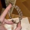 Pulsera tejida calada de estilo vintage europeo y americano, sensación de lujo ligero y alta gama, versátil para el trabajo, accesorio de mano exquisito y simple al por mayor