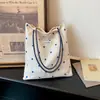 Bolsa de tela de lunares estilo coreano para mujer, nuevo modelo 2026, bolso de hombro de gran capacidad, bolso tipo cubo tote de estilo relajado y casual