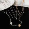 Collar con colgante de corazón redondo tachonado de diamantes, estilo dulce y fresco para mujer, cadena para suéter de diseño nicho, collar elegante y versátil de otoño/invierno