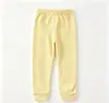 Coleção de primavera e outono transfronteiriça: Calça longa lisa, elástica, casual e esportiva para meninos e meninas, adequada para uso interno e externo