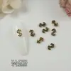 Ventas Directas de Fábrica de Nuevos Pedrería Retro Cruzada para Uñas de Moda al Por Mayor, Decoraciones para Uñas con Forma de Corazón y Cabeza de León