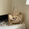 Versión Coreana Ins Nuevo Aspecto de Alta Calidad Lindo Dibujo Animado de Perro Bolso Tote Simple para Mujeres Ligero Ropa de Trabajo Bolso Cruzado de Gran Capacidad