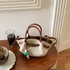 Bolso grande de mujer transfronterizo 2026 nuevo versátil simple de hombro cruzado para ir al trabajo, bolso tipo cubo moderno con bloques de color