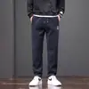 Moda masculina outono e inverno, calças versáteis de corte reto e folgado, calças esportivas casuais chinesas bordadas para homens jovens