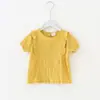 Ropa de Verano para Niños 2025 Blusa para Niñas Estilo Coreano con Borde de Volantes Tops de Manga Corta de Moda para Niñas Venta al por Mayor desde Fabricante