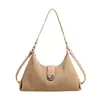 Nuevo modelo de bolso 2026, bolso de axila a rayas con diseño nicho coreano, bolso de hombro versátil de alta gama para mujer