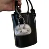 Bolsa de cuero remachada a mano con colgante de cuero plateado 2025 nuevo bolso de saturno plateado de alta gama colgante de polvo para bolso llavero
