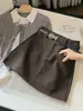 Saia midi de lã em A para meninas baixas anti-exposição feminina outono novo estilo versão coreana cintura alta justa ao corpo saia curta