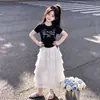 2026 Camiseta de Manga Curta com Cordão e Laço Doce Estilo Princesa Saia de Renda Bolo Conjunto de Duas Peças de Verão para Meninas
