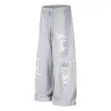 Calça de moletom estampada floral cruzada solta de perna larga para homens, vibe hip-hop moda de rua, calças de corte reto com design único