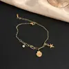 Acero de titanio carcasa que no se decolora diseño de estrella de mar tobillera dorada cadena de fútbol para mujer cadena de tobillo accesorios de lujo de alta gama de verano