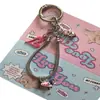 Colgante de salchicha en forma de corazón rosa pálido, dulce y fresco, cadena para teléfono de hueso de serpiente, llavero de dibujos animados lindo y charm para bolso