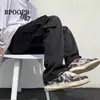 Calça cargo masculina moderna com bolsos grandes, estilo ins, moda outono, high street, estilo japonês, funcional, corte solto, perna reta, tornozelo afunilado, calça casual