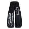 Calça de moletom estilo americano, de rua, com aspecto desgastado, estampa de letras cruzadas, perna larga, corte curvo, unissex, adequada para dança de jazz, com um estilo fluido e casual