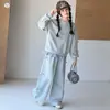 Conjunto de Roupa Esportiva Estilo Coreano para Meninas 2026 Novidades de Outono Crianças de Tamanho Médio e Grande Hoodie Falso de Duas Peças Calça de Moletom com Laço Conjunto de Duas Peças