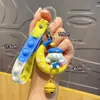 Liquidación de colección de llaveros colgantes de personajes de dibujos animados IP auténticos, lindos colgantes de estrella-luna-conejo para bolsos de niñas, stock para vendedores ambulantes