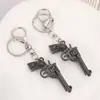 Llavero de Metal con Arma Estilo Punk Retro Europeo y Americano Diseño de Nicho Colgante para Coche Accesorios Llavero para Bolso
