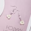 Pendientes de perlas y flores de alta gama con un diseño de nicho de lujo ligero y de nueva tendencia, bonitos y frescos pendientes para niña.