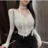 Ropa de mujer de comercio exterior de Dongdaemun, Corea del Sur, nueva colección otoño e invierno, elegante y ajustada, que acentúa la figura, con diseño de cinta, ceñida, estilo corto