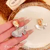 Pendientes Pequeños de Cristal Color Dorado Titanio Champagne Hoja de Ginkgo de Gama Alta, Pendientes Muy Bonitos para Mujer, Pendientes Estilo Nuevo 2026