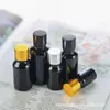 Botella de vidrio negro al por mayor para aceite esencial, frasco gotero oscuro para aceite medicinal, frasco pequeño vacío, botella de mezcla de solución madre de esencia, frasco sellado