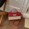 Bolsa feminina de design de nicho estilo francês, novo modelo 2026, bolsa transversal versátil color-blocking, bolsa de mão quadrada pequena fashion e super popular
